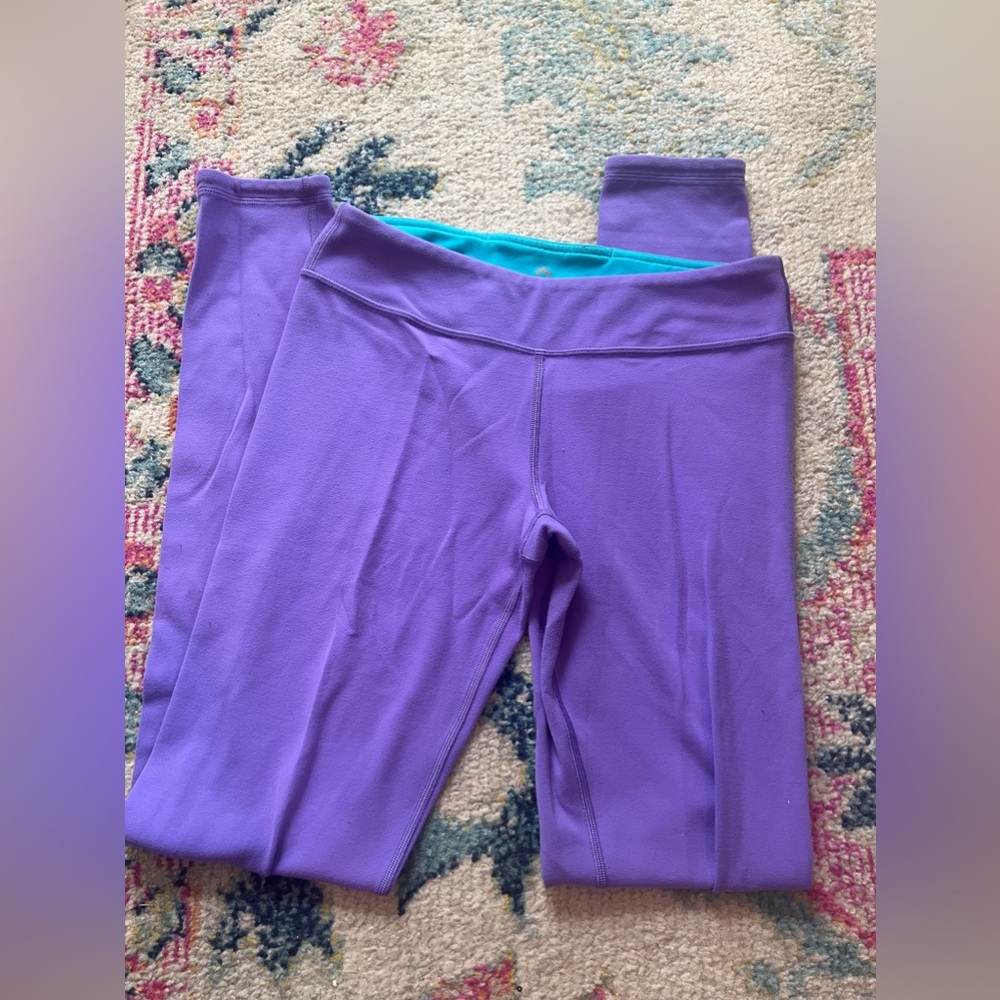 Blue / purple reversible leggings. Ivivva Kids size Large.